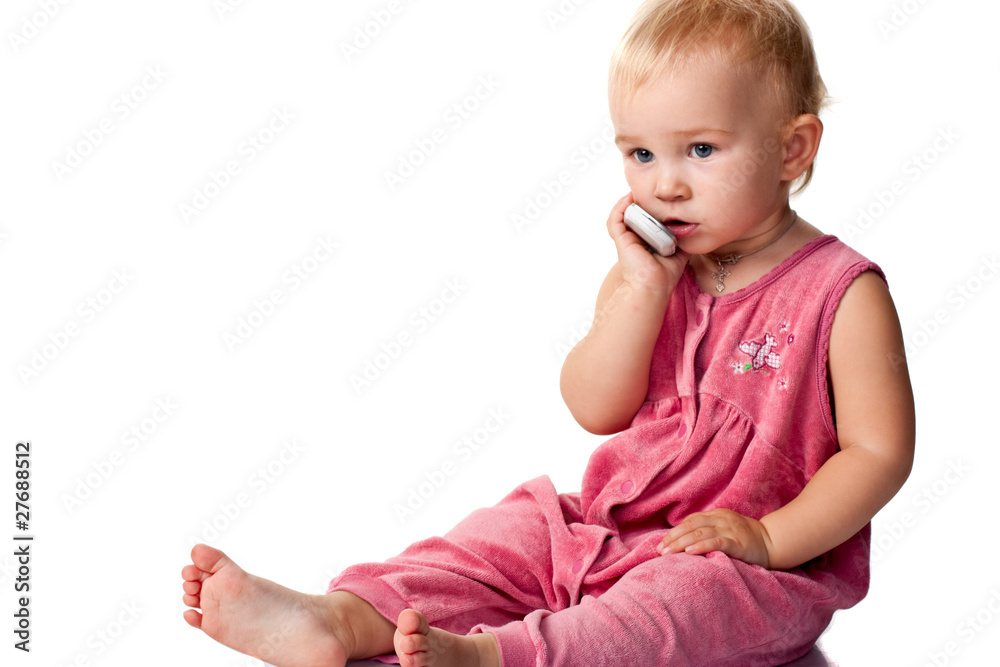 Baby talking on the mobile phone isolated on white Baby talking on the mobile phone isolated on white
