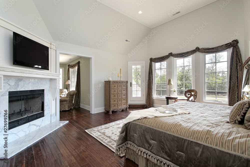 Master bedroom with marble fireplace Master bedroom with marble fireplace