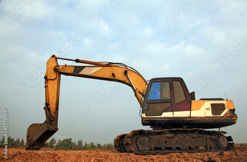 Excavator Loader with backhoe standing in sandpit