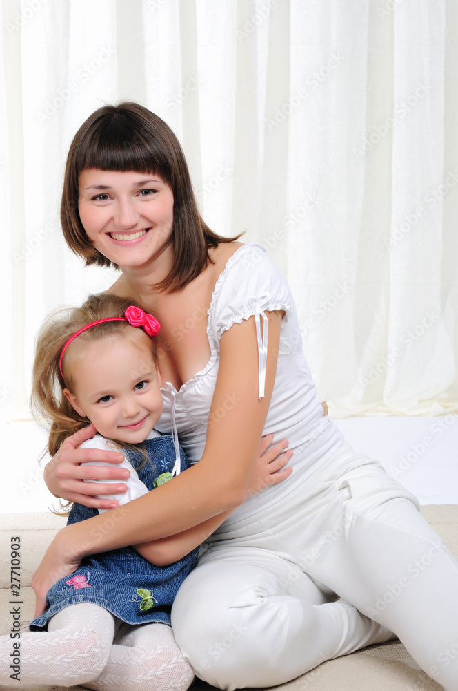 Young mother and her young daughter Young mother and her young daughter