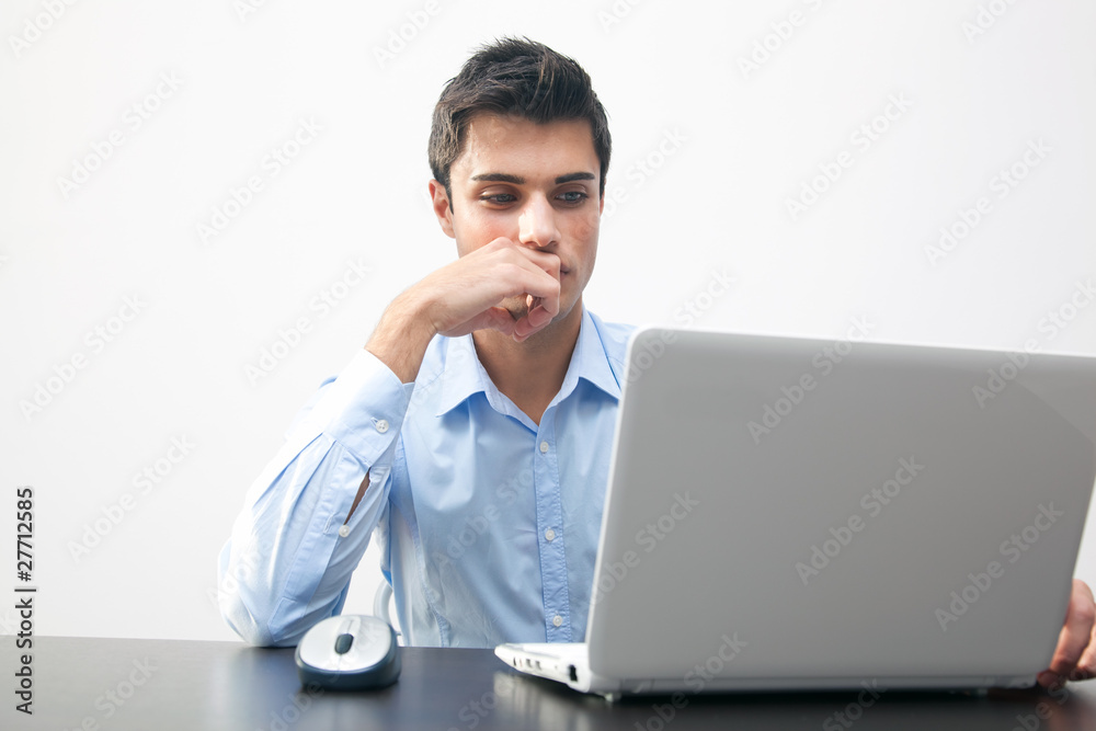 Thoughtful business man working at the laptop Thoughtful business man working at the laptop