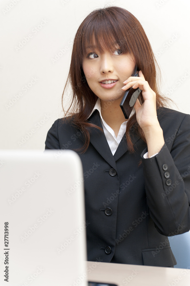 a portrait of young business woman on the desk a portrait of young business woman on the desk