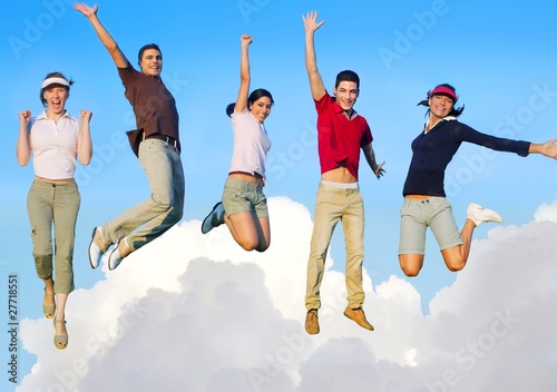 Jumping young people happy group flying in sky