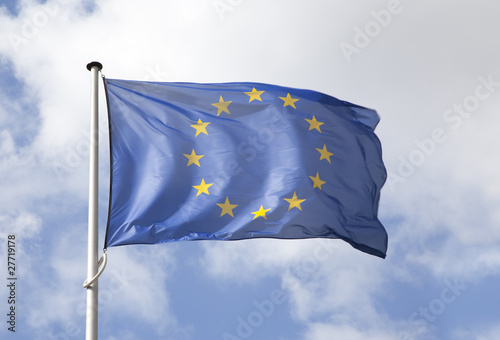European flag flowing in the wind over blue sky