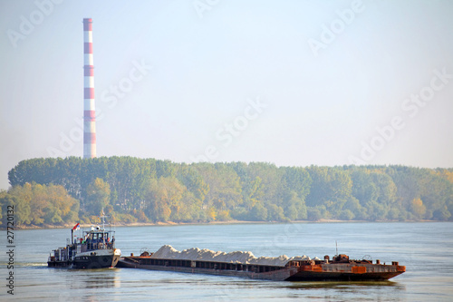 Cargo ship and heating plant at the Danube photo