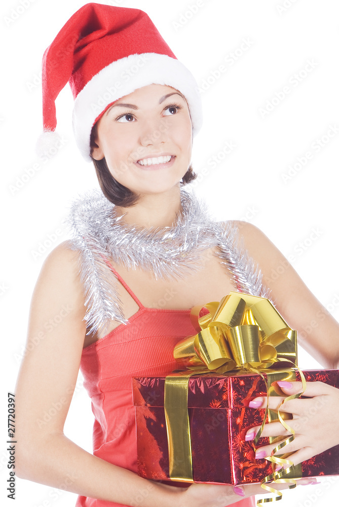 Beautiful christmas woman in santa hat holding gift Beautiful christmas woman in santa hat holding gift