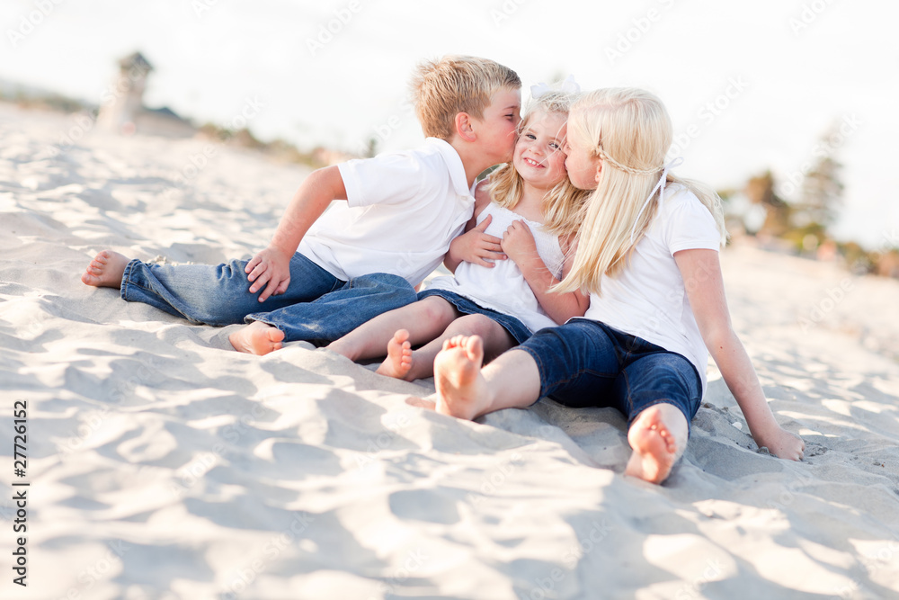 Adorable Sibling Children Kissing the Youngest Adorable Sibling Children Kissing the Youngest