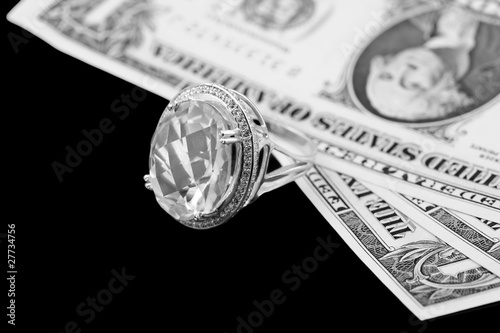 American dollars and jewelry diamond ring © elen_studio