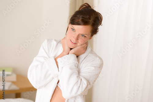 Morning bedroom - woman in bathrobe