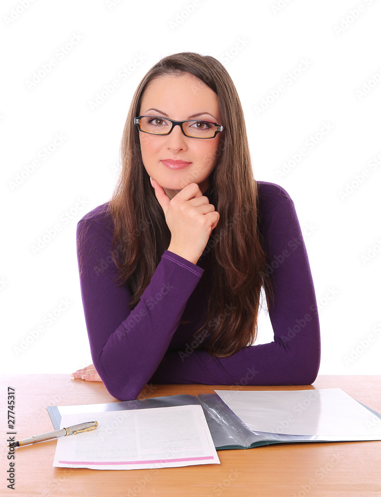 beautiful girl with glasses sitting at the table and smiling beautiful girl with glasses sitting at the table and smiling