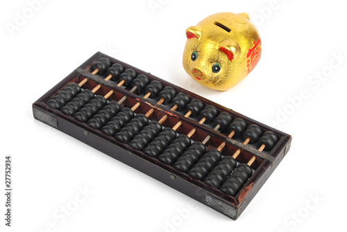 Piggy bank and chinese abacus photo