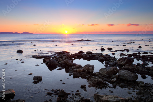 colorful sunrise on the rocky coast