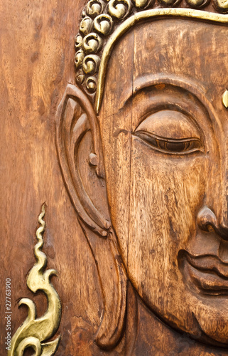 Buddha' face, carving from teak wood in Thai style