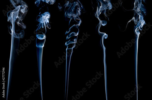 five different separate wisps of smoke on black;