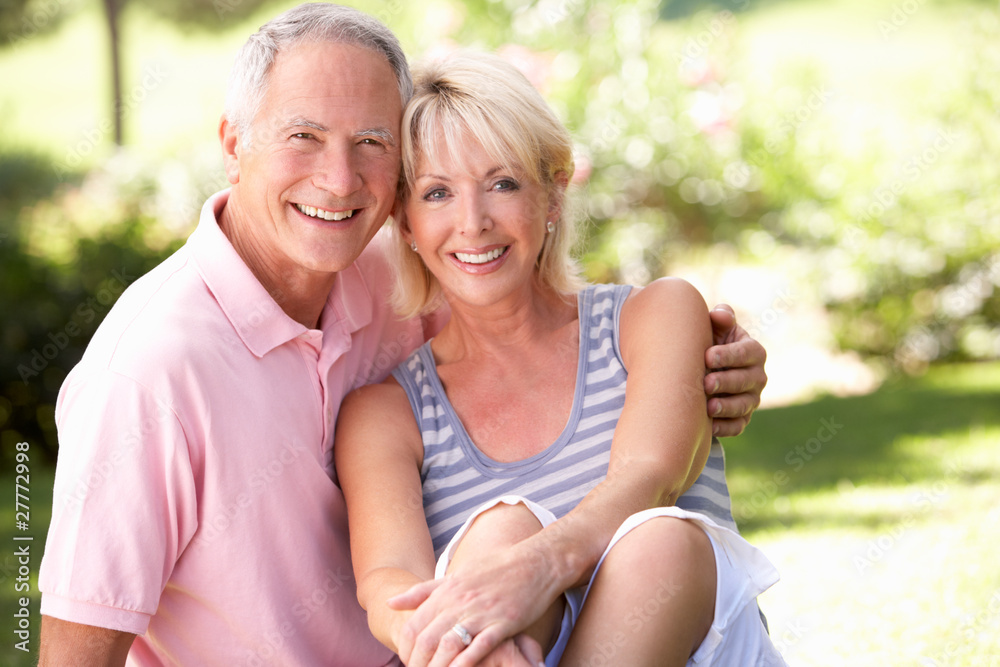 Senior couple relaxing together in park Senior couple relaxing together in park