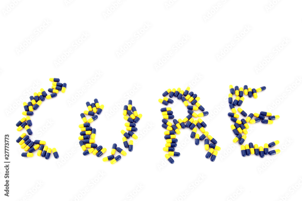 word CURE made from blue yellow capsule pills word CURE made from blue yellow capsule pills