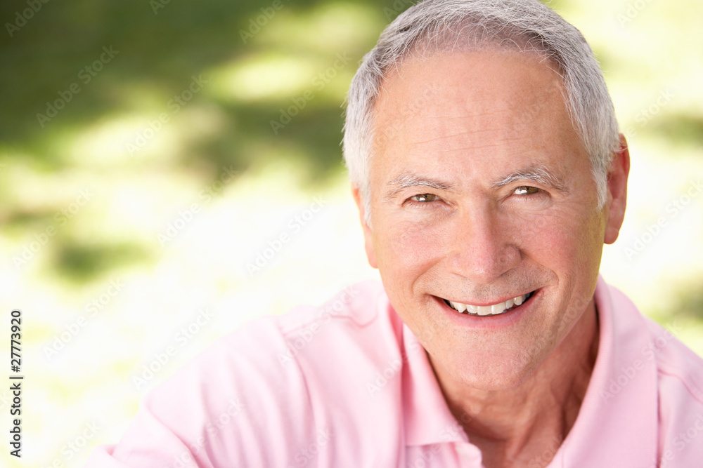 Senior man relaxing in a park Senior man relaxing in a park