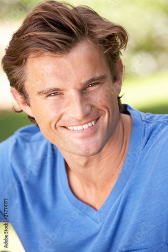 Portrait Of Young Man Relaxing In Park