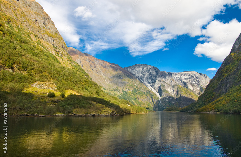 Mountains and norwegian fjord in autumn