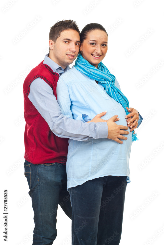 Man embracing his pregnant wife Man embracing his pregnant wife