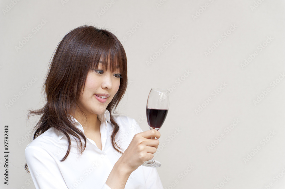 a portrait of young woman taking a red wine a portrait of young woman taking a red wine