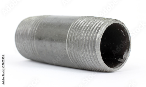 Canvas Print Small black threaded pipe laying on a white background