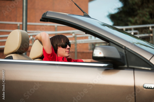 Young man in a convertible.