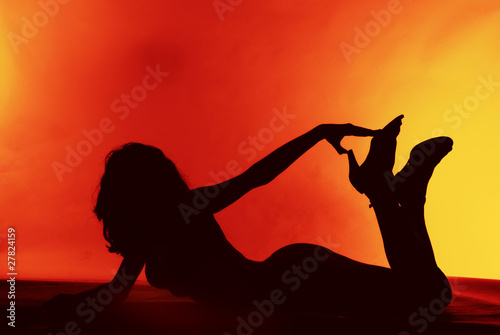 Sexy girl silhouette on a red background