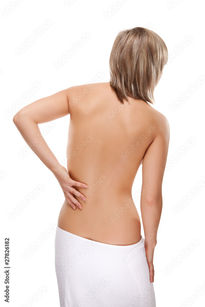 Woman massaging pain back isolated on white Woman massaging pain back isolated on white