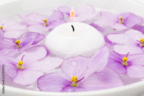 Floating candle and lilac flower