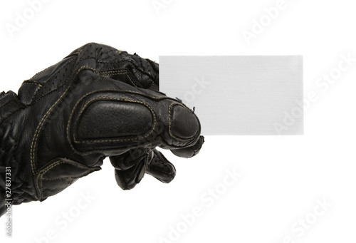 visit card in man's hand with motorcycle glove