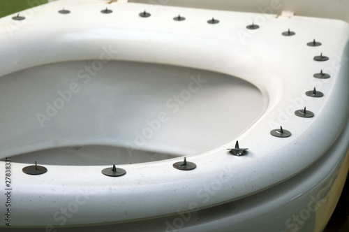 metall circle sharp buttons on the top of toilet photo