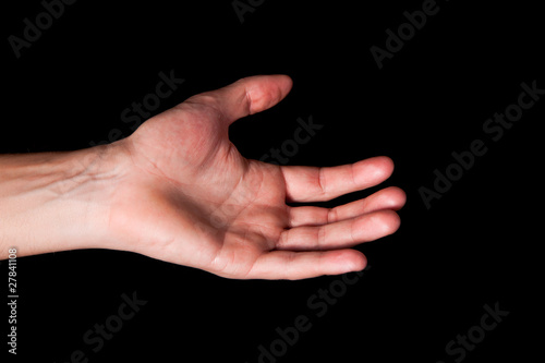 Male hand on black background