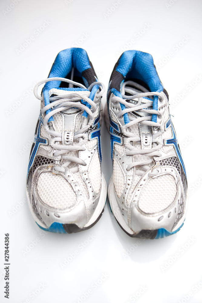 Pair of running shoes on a white background. (shallow DOF; color Pair of running shoes on a white background. (shallow DOF; color