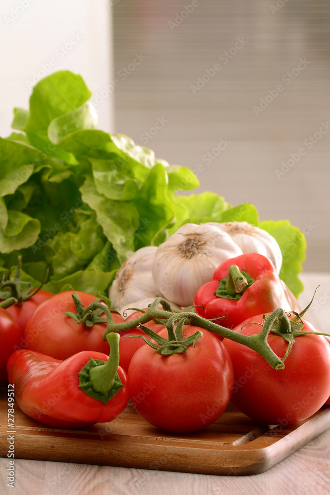 Composition with raw vegetables on kitchen table Composition with raw vegetables on kitchen table