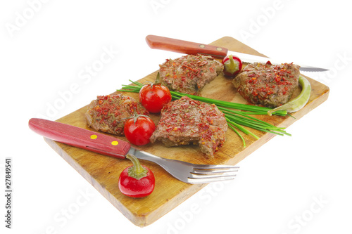 roasted spicy meat over white photo