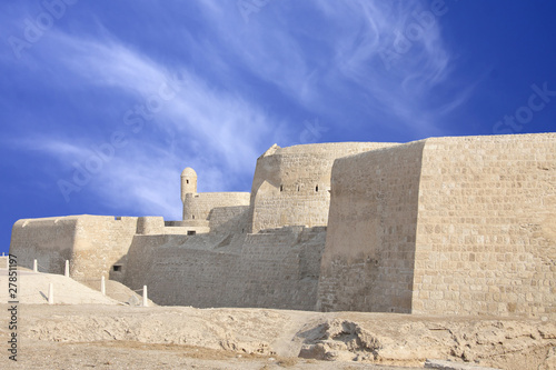 Southern wall of Bahrain fort with visible watch tower photo