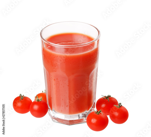 Fresh tomatoes and a glass full of tomato juice