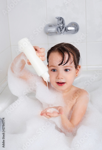 little girl taking a bath