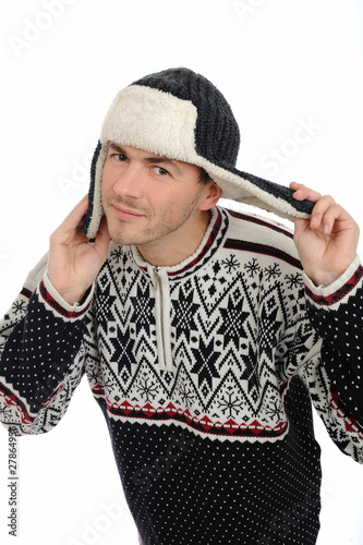 Funny winter man in warm hat and clothes listening. isolated on photo