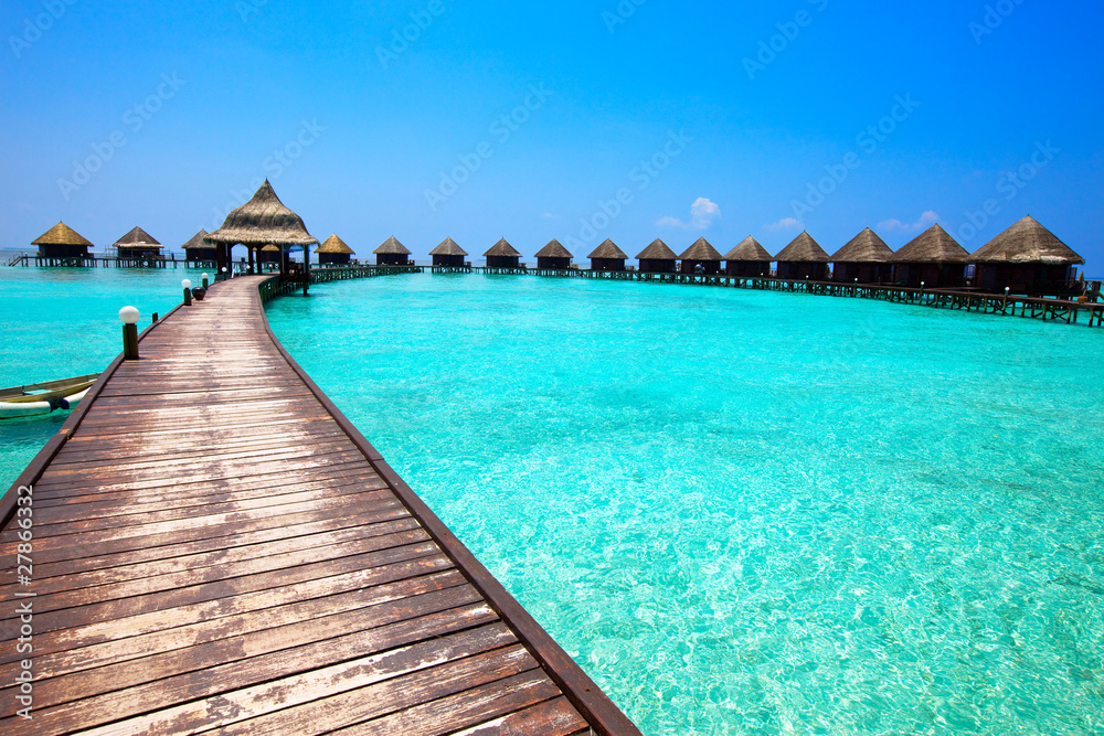 Maldives. .Villa on piles on water.