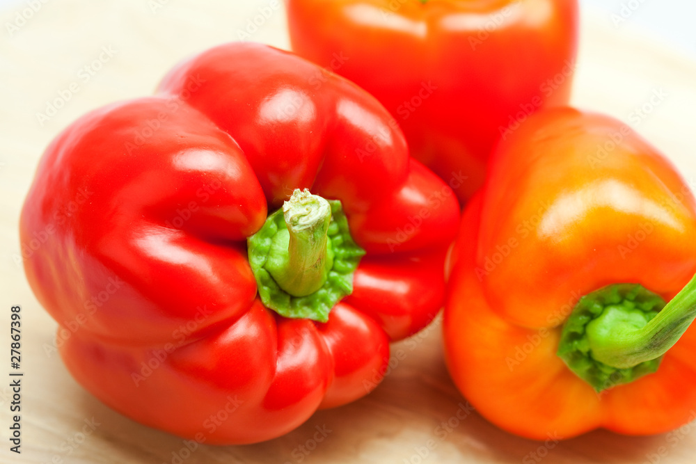 red pepper on a cutting board isolated on white red pepper on a cutting board isolated on white