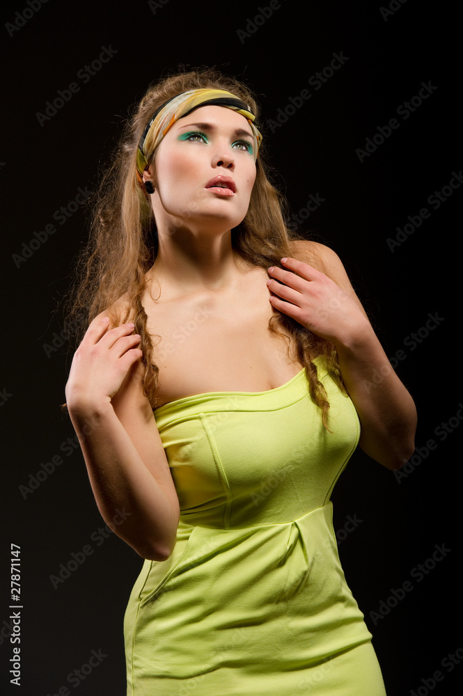 Young beautiful woman with long curly hairs isolated on black Young beautiful woman with long curly hairs isolated on black