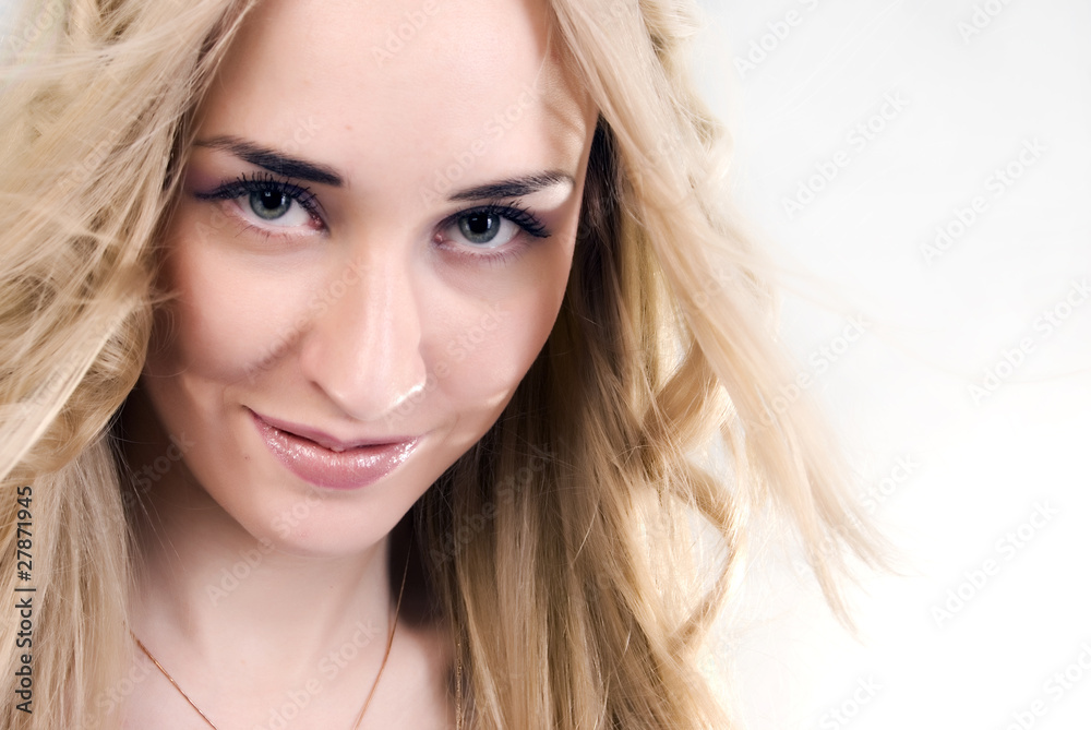 Fototapeta premium Portrait of a young girl smiling