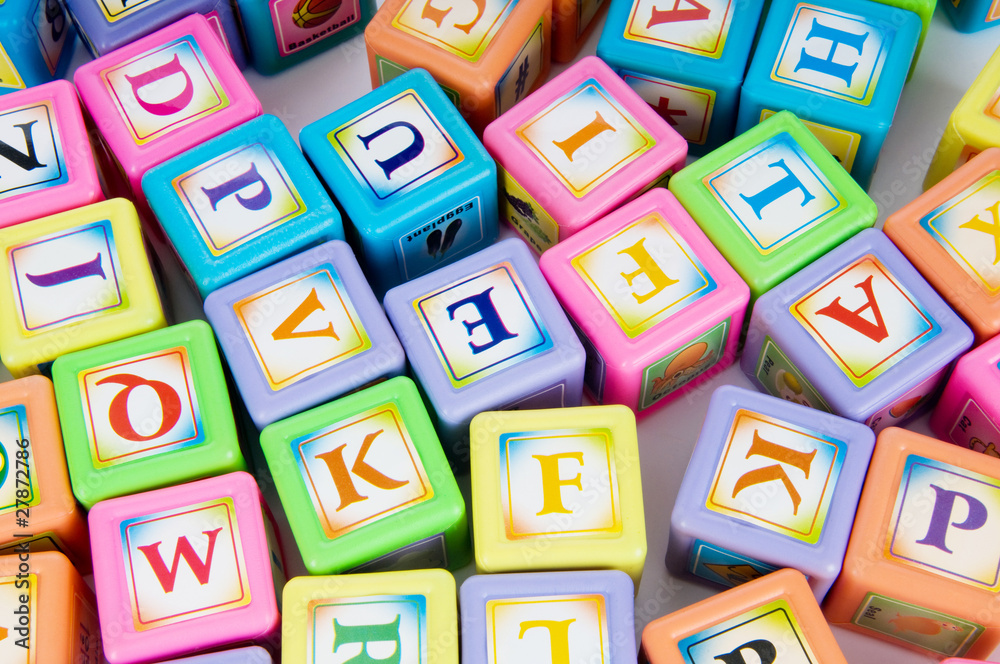 Learning and education concept - pile of alphabet blocks Learning and education concept - pile of alphabet blocks