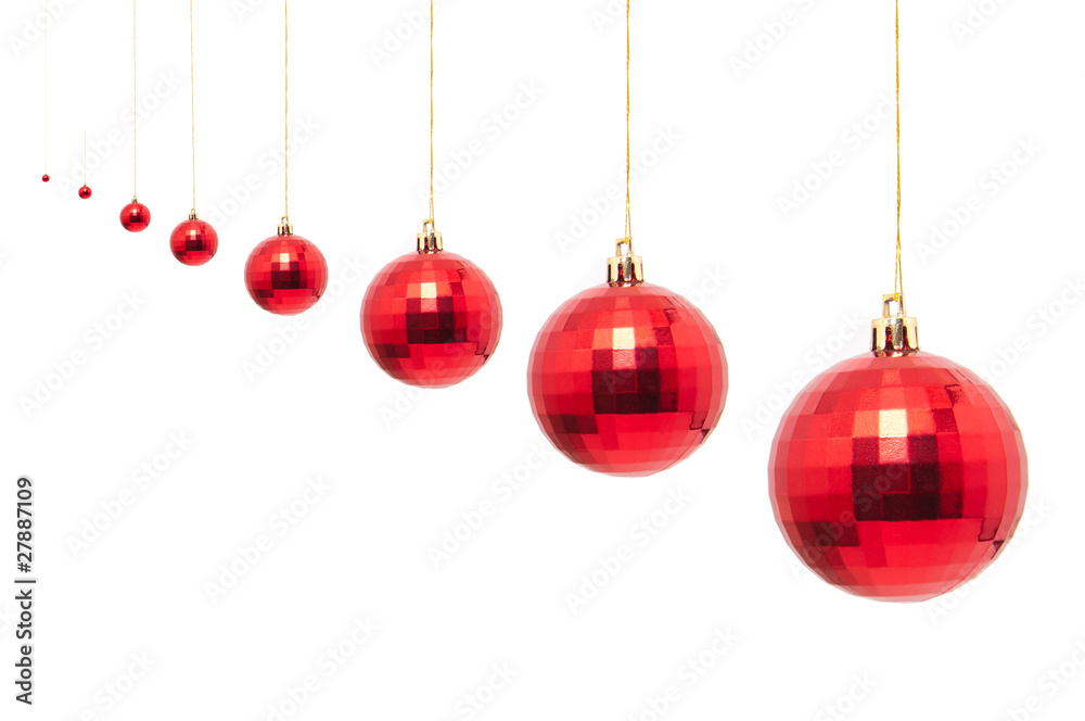 red christmas bauble with ribbon isolated on white background red christmas bauble with ribbon isolated on white background