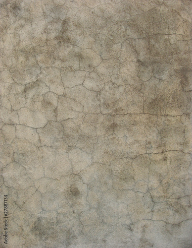 worn gray beige blue grunge wall with multiple cracks