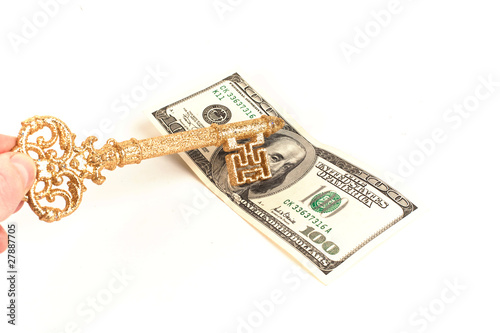 Gold key on hundred dollars