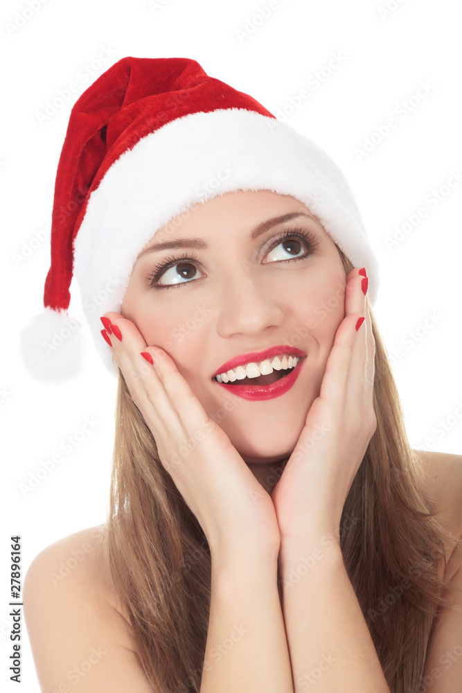 Beautiful young woman in red wearing santa hat. Isolated on whit Beautiful young woman in red wearing santa hat. Isolated on whit