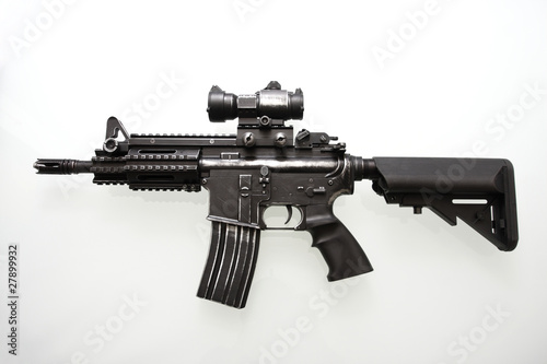 Heavily used military M16 rifle with short barrel photo